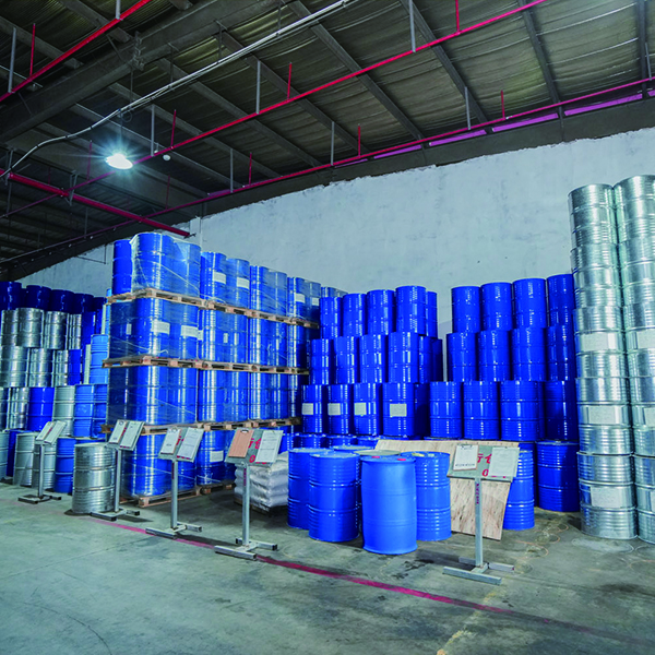 Blue steel drums stacked on pallets in the Eapearl warehouse